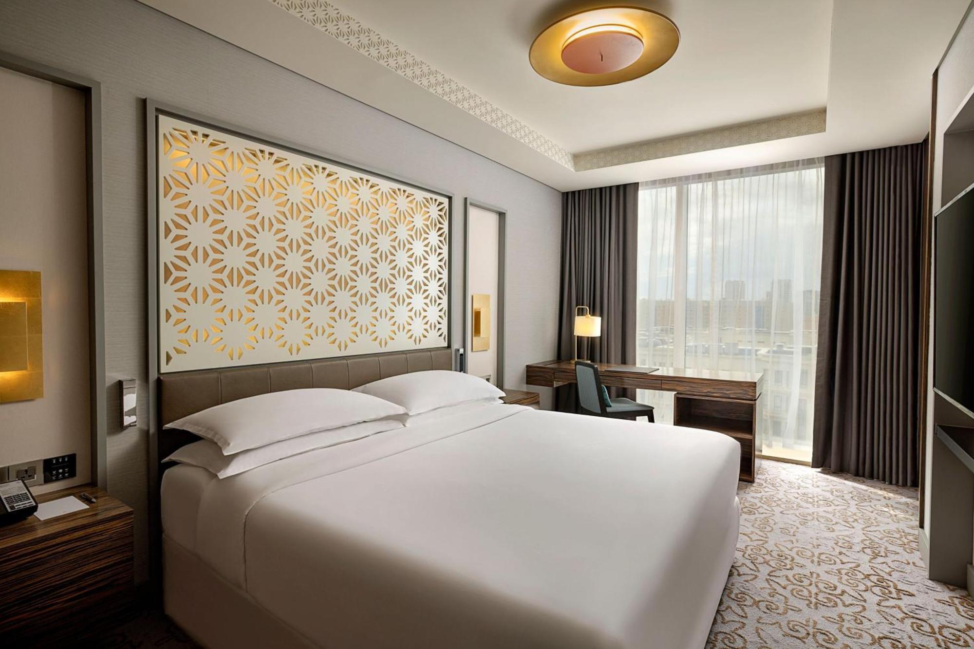 Sheraton Astana Hotel Exterior photo A bedroom at the hotel