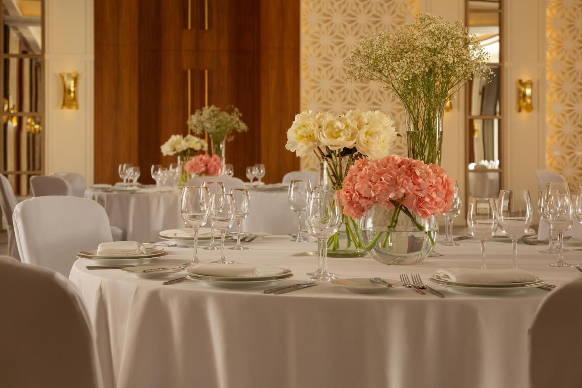 Sheraton Astana Hotel Exterior photo A table set for a formal dinner